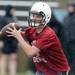 A Saline High School quarterback looks to throw the ball during practice at the school on Monday, August 12, 2013. Melanie Maxwell | AnnArbor.com